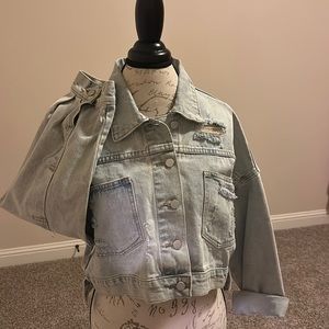 Distressed, light blue , blue Jean jacket with puffy arms